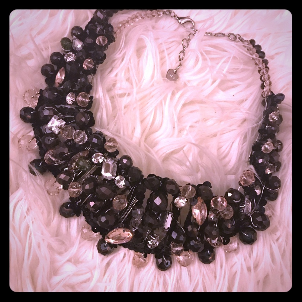 Also black with silver necklace